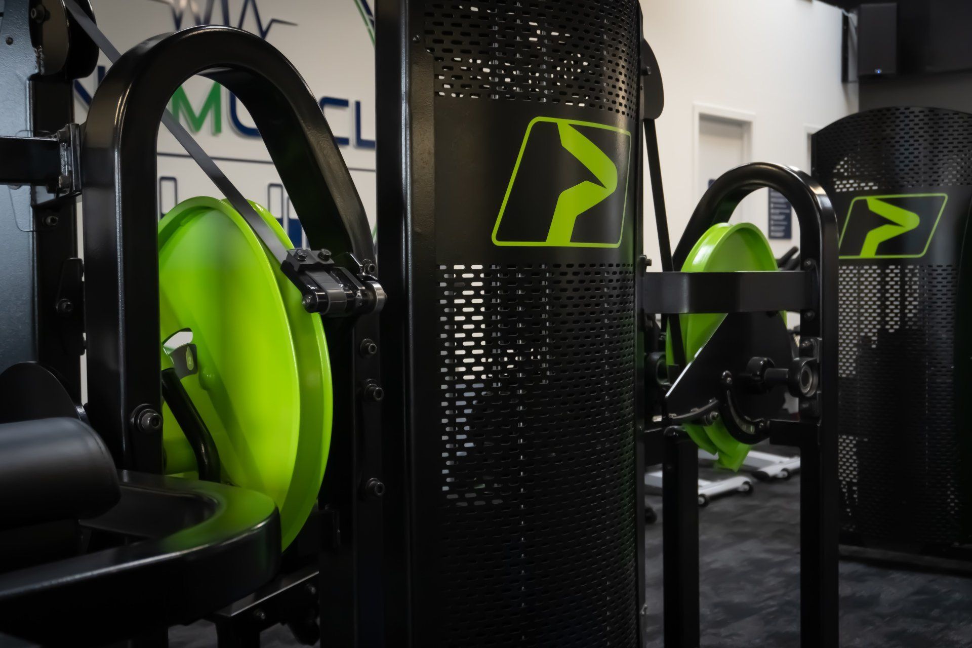 Mind Muscle branded dumbbells on rack